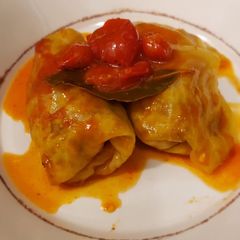 A picture of Niños envueltos (stuffed cabbage rolls).