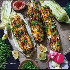 A picture of Roasted Corn Butter Masala Bhutta.