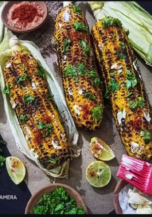 A picture of Roasted Corn Butter Masala Bhutta.