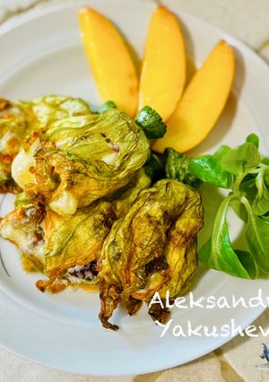 A picture of Stuffed zucchini flowers.