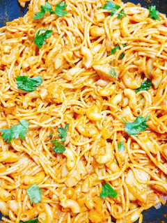 A picture of Leftover macaroni spaghetti in tomato creamy sauce.