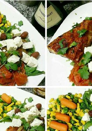A picture of Grilled Pork steak served with cooked Herb salad.