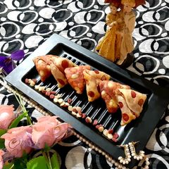 A picture of #Veggies Stuffed Cheesy Beetroot Samosas.