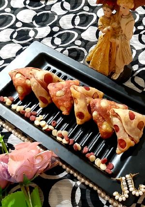 A picture of #Veggies Stuffed Cheesy Beetroot Samosas.