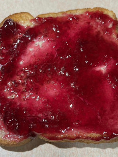 A picture of Butter and Plum Jelly Toast.