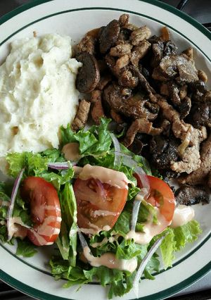 Una foto de Puerco con champiñones 🍄