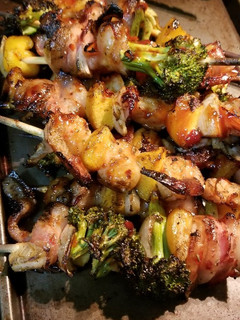 A picture of BBQ, Sweet Chili, & Peach Bacon Wrapped Shrimp Kabobs.
