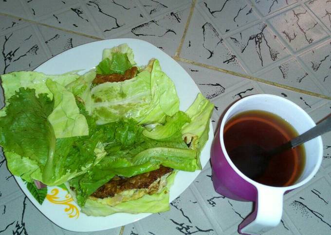 Fried Eggs wrapped in cabbage and lettuce with Tea