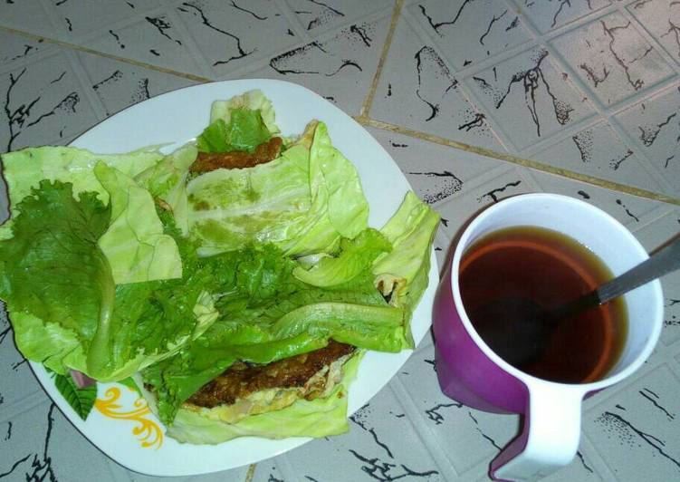Fried Eggs wrapped in cabbage and lettuce with Tea