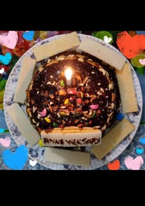 A picture of Wheat flour and oats eggless chocolate cake with dry fruits.