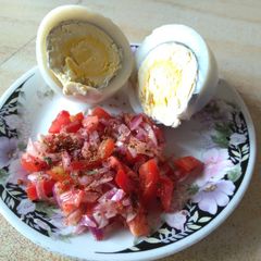 A picture of Boiled eggs with kachumbari.