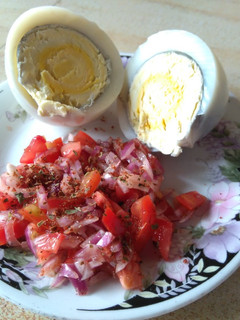 A picture of Boiled eggs with kachumbari.
