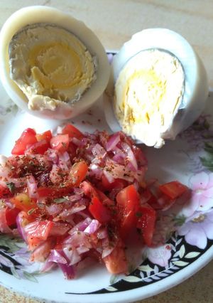 A picture of Boiled eggs with kachumbari.