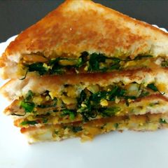 A picture of Tofu and spinach sandwich.