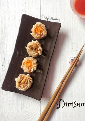 A picture of 326. Chicken and Shrimp Siomay Dumplings (Topped with Carrot and Button Mushrooms).