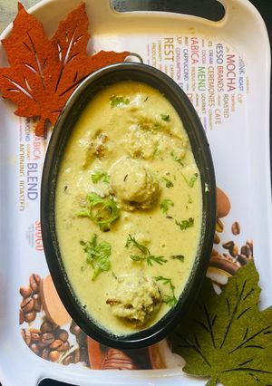 A picture of Yellow Gravy with bottle Gourd Kofta.