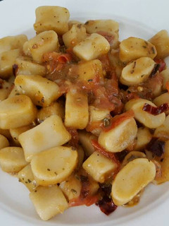 A picture of Gnocchi in chili tomato sauce.
