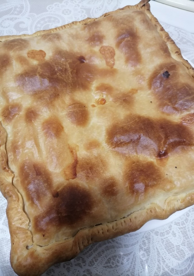 Una foto de Empanada de pollo, bechamel y queso