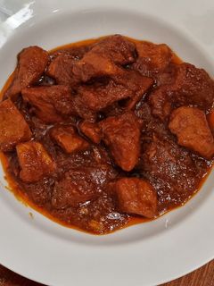 Una foto de Carne con tomate