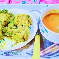 A picture of Homemade Tomato soup & Grilled chicken with saute green capsicum.