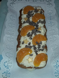 Una foto de Cake de mandarina con cremoso de yogur y chocolate blanco