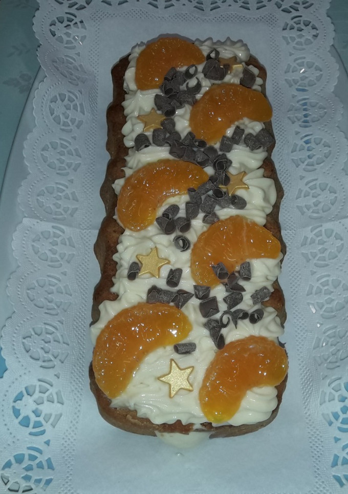 Una foto de Cake de mandarina con cremoso de yogur y chocolate blanco