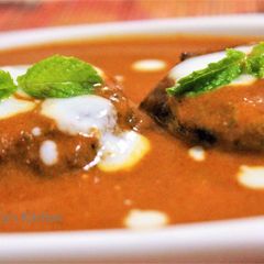 A picture of Grilled Kathal Ke Shami Kebab in Makhni Gravy.