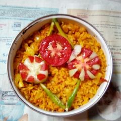 A picture of Poha with veggies.
