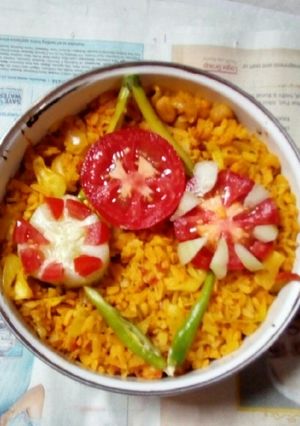 A picture of Poha with veggies.