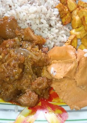 A picture of Native sauce, Ofada rice, moi moi and plantain.