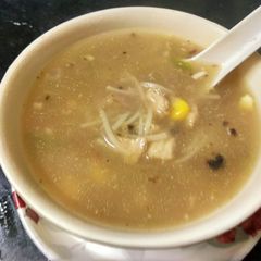 A picture of Burnt garlic chicken noodle soup.