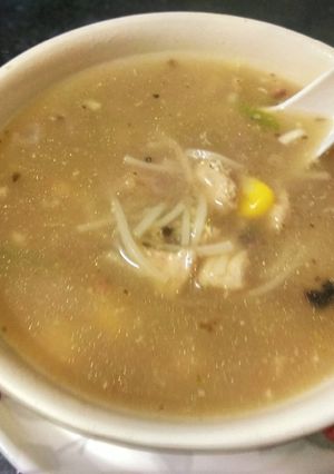 A picture of Burnt garlic chicken noodle soup.