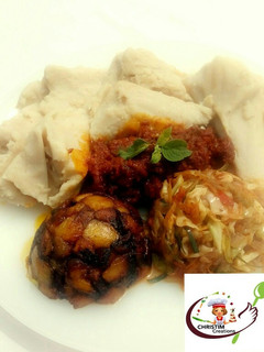 A picture of Ekuru (ofuloju)with atadindin,masala vegies and dodo.