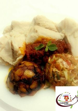 A picture of Ekuru (ofuloju)with atadindin,masala vegies and dodo.