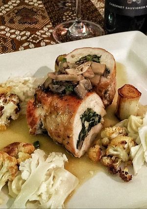 A picture of Chicken Roulade Stuffed with Wild Mushroom and Spinach.