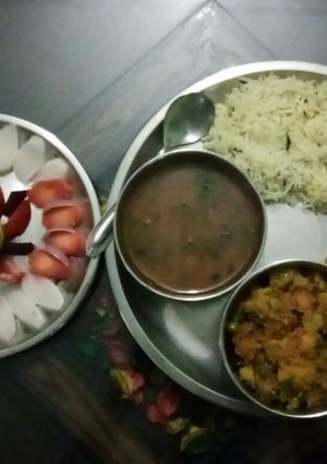 A picture of Indian Thali(daal tadka,mix veg, jeera rice, roti or salad).