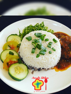 A picture of Rice and beans with stew.
