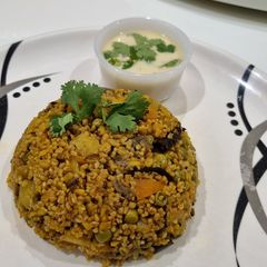 A picture of Veggie broken wheat Dalia (Khichdi).