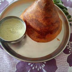 A picture of Tomato cone dosa.
