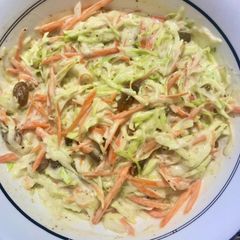 A picture of Coleslaw with raisins.