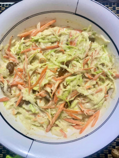 A picture of Coleslaw with raisins.