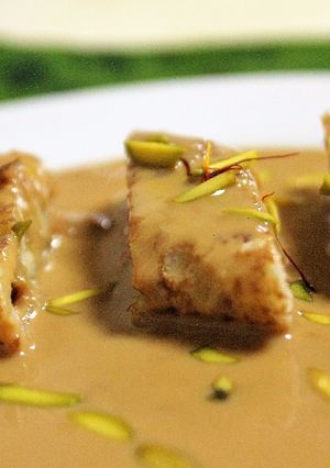 A picture of Patishapta Pithe in Caramelised Rabri.