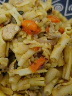 A picture of Macaroni, chicken and mixed vegetables.