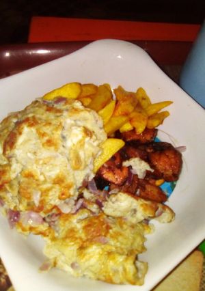 A picture of Fried Irish Potatoes and plantain with fried egg.