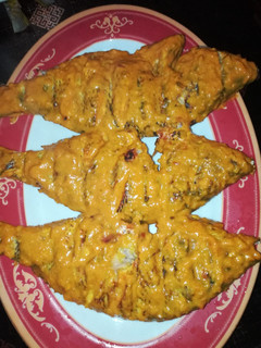 A picture of Samaki wa kupaka (grilled fish with coconut sauce).