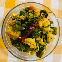 A picture of Drumstick leaves with sun dried lentil dumplings.
