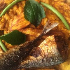 A picture of Porridge beans,fried plantain and fish.