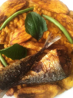 A picture of Porridge beans,fried plantain and fish.