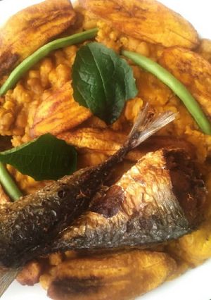A picture of Porridge beans,fried plantain and fish.