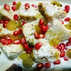 A picture of Curd idli with fruits.